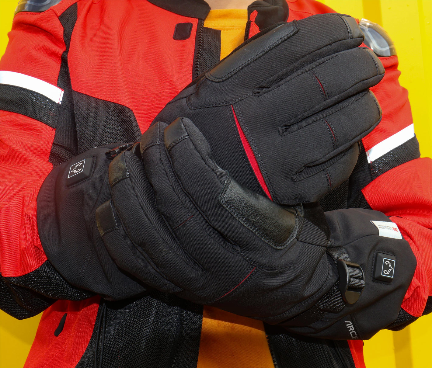 A man wearing a  “crab leg” heated gloves shows off this comfortable glove