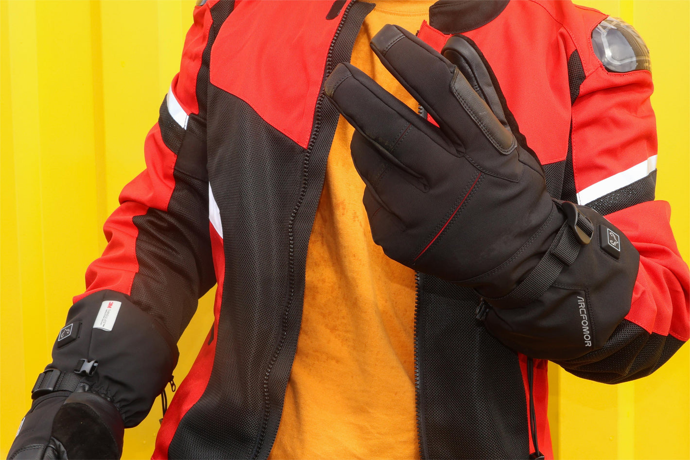 A man wearing a  “crab leg” heated gloves shows off this comfortable glove