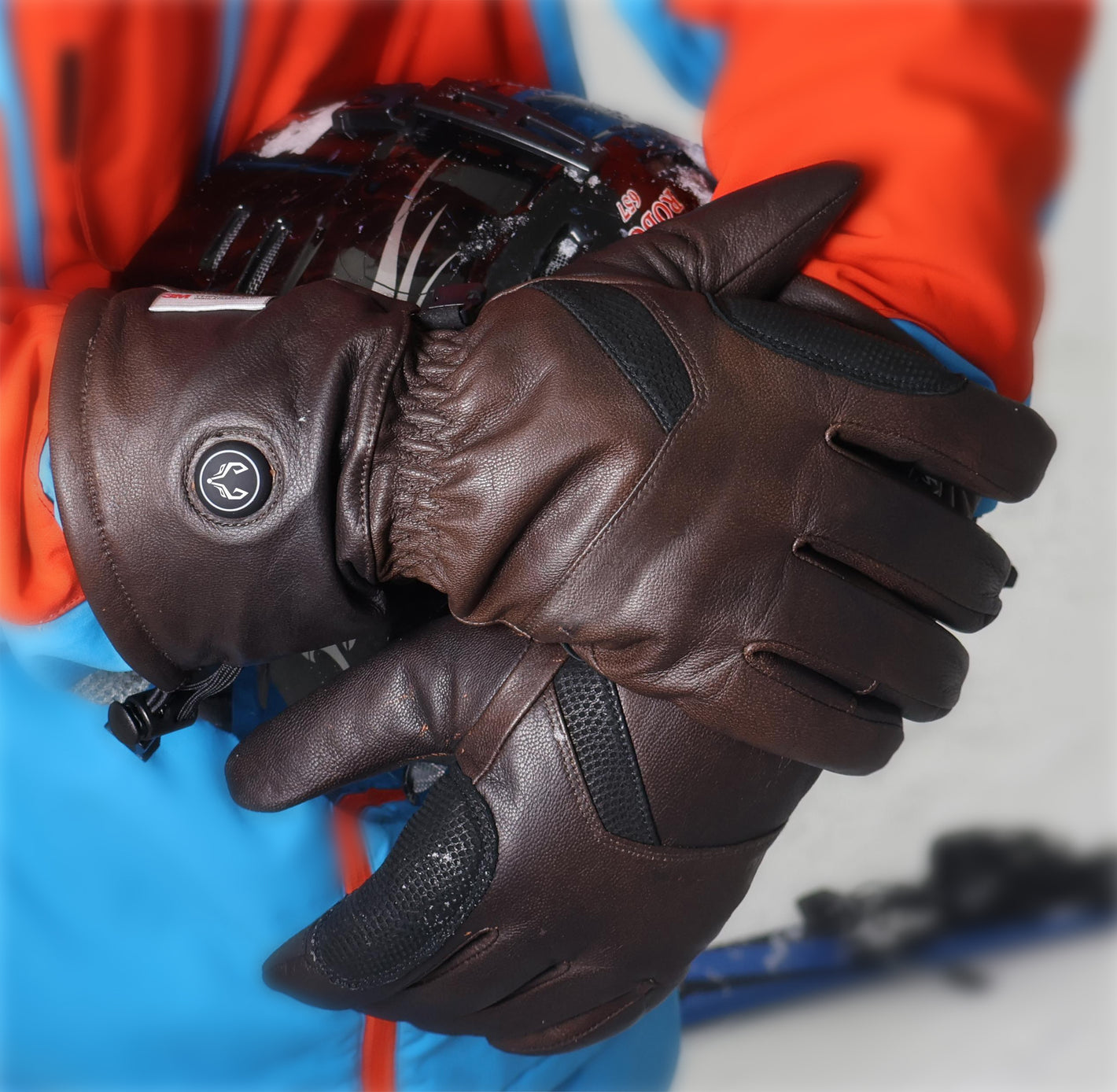 A man skiing happily wearing Vellum heated gloves