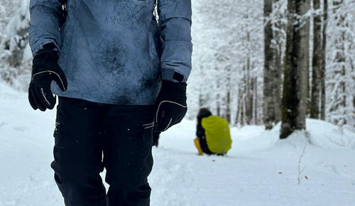 A man enjoying the warmth of Arcfomor's heated gloves on a cold winter day
